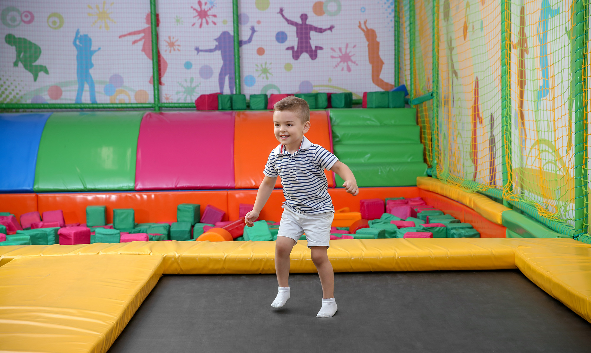 young boy at trampoline park